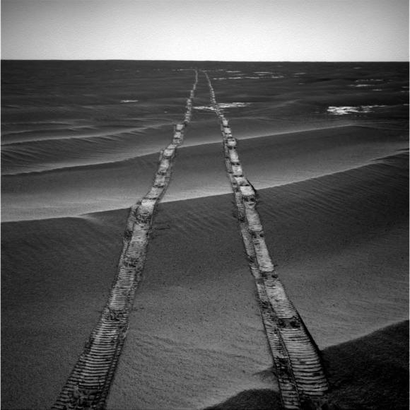 In this navigation camera raw image, NASA's Opportunity Rover looks back over its own tracks on Aug. 4, 2010. Image Credit: NASA/JPL-Caltech